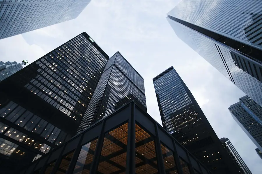 Multiple corporate towers viewed from below — a multi-entity group structure